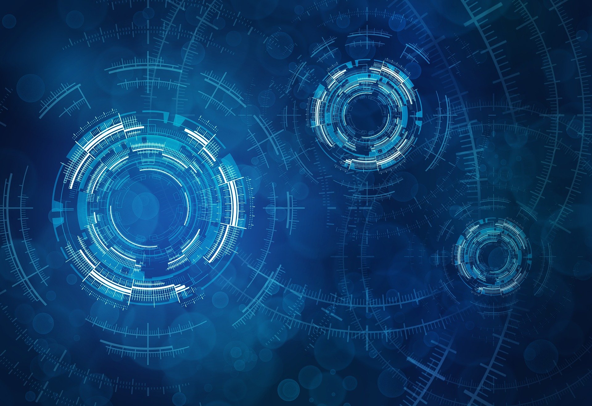 The image shows a futuristic digital interface with abstract circular elements and blue-toned visualizations, evoking a high-tech or data-driven theme.